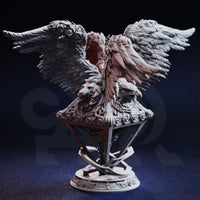 Unpainted grey resin miniature of the Cherubim Gatekeeper of Syelden, photographed from the front, showing the lion and eagle faces, wide feathered wings, and the detailed celestial geometric base with a circular plinth
