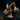 Choker miniature by Monster Atlas: gaunt aberration crouching low, both serrated-clawed arms raised wide, webbed feet planted, mouth open in a snarl. Plain base.