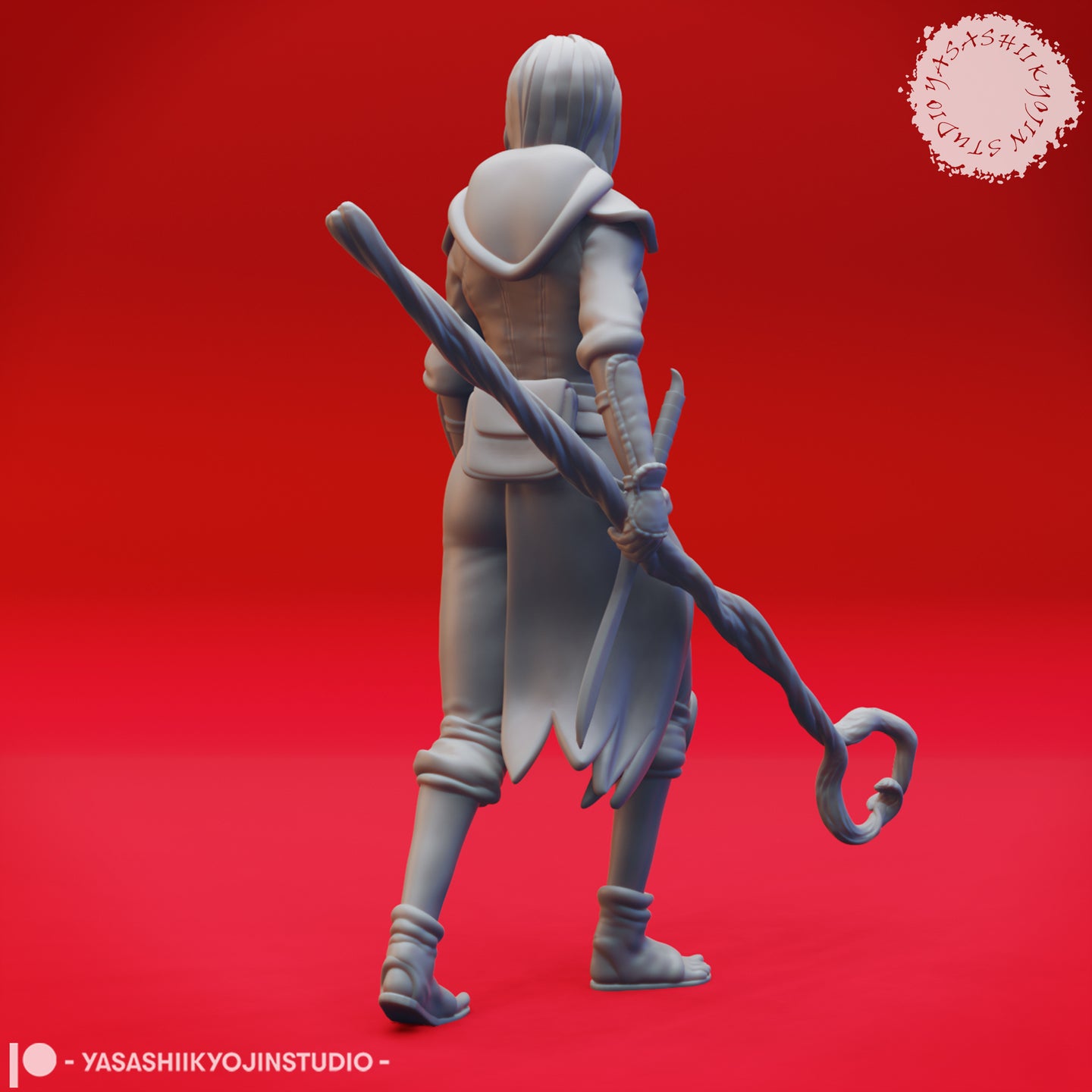 Rear three-quarter view of the same unpainted grey female druid miniature showing the full length of her twisted gnarled staff, layered clothing detail including her hooded collar and knotted sash, and sandalled feet with leg wraps