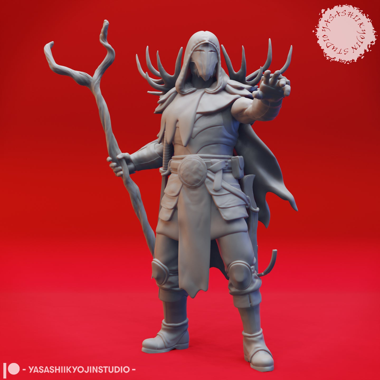 Front view of an unpainted grey resin render of Druid 03 by Yasashii Kyojin Studios — a hooded, masked male figure with large antlers rising from behind his hood, holding a gnarled twisted wooden staff in his left hand and reaching forward with his right hand, wearing a flowing cloak, layered pouches, and armoured boots