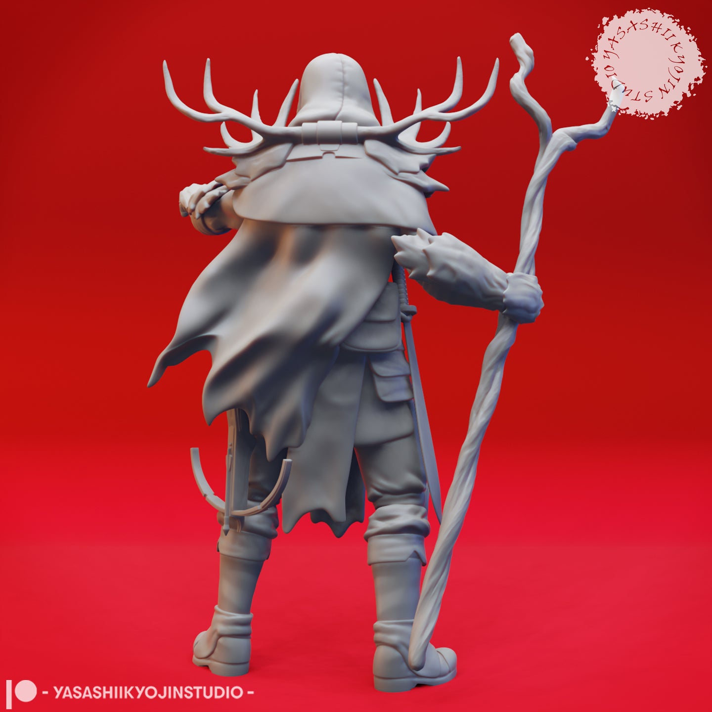 Rear view of the same unpainted grey resin render of Druid 03 — showing the full billowing cloak, antler crown spreading wide from the hood, a small bundled satchel at the base of the staff, and detailed belt and leg armour
