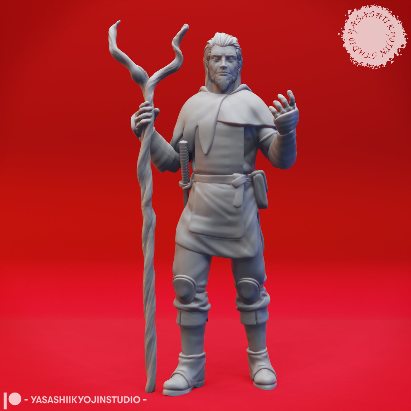Front view of an unpainted grey resin 3D printed male druid miniature holding a tall gnarled forked staff in his left hand and raising his right hand mid-spell, wearing a layered tunic, hooded capelet, knee-guards and buckled boots with a short blade and pouch at his belt