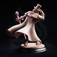 Rear three-quarter view of the unpainted grey resin Cobalt Fairfax miniature on a plain black background, showing the billowing coat with woven fabric texture, frilled collar, top hat, and staff with orb pommel, mounted on a sculpted cobblestone round base