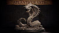 Bone Naga skeletal serpent miniature by Atlanticus Arts, rearing upright with wide-flared ribcage hood and snarling draconic skull, coiled body resting on a bone-and-rubble scenic base.