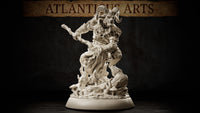 Goat-horned satyr miniature leaning forward with a twisted wooden staff extended, one hoof raised on gnarled roots, wearing layered wraps and leaf pauldrons, mushroom-scattered forest base. Sculpt by Atlanticus Arts.