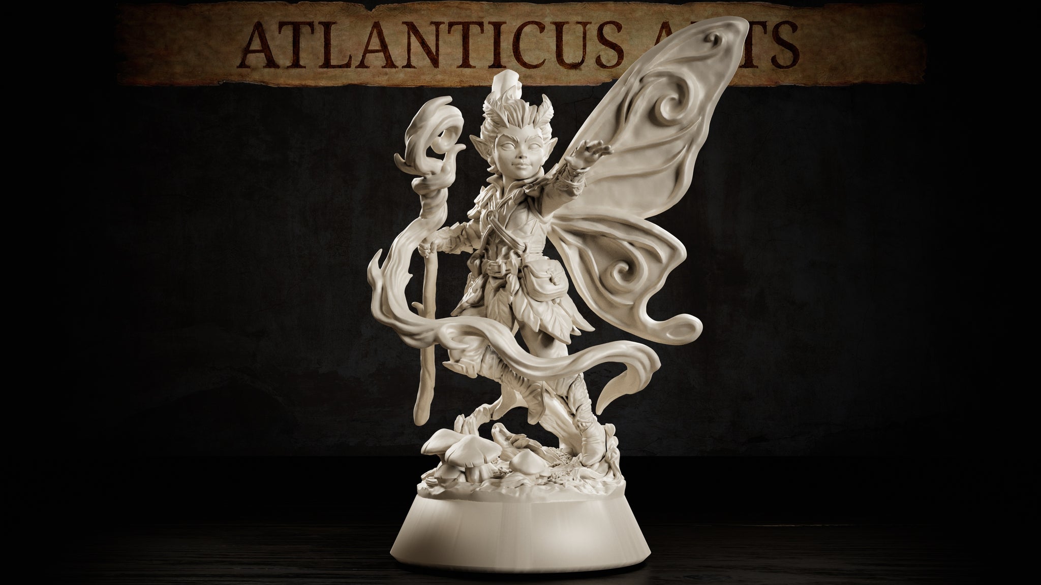 Winged pixie miniature gripping a gnarled root staff topped with a hollow mask, one hand raised, wearing leaf-and-feather armour, standing on a mushroom-scattered base. Sculpt by Atlanticus Arts.