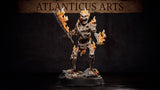 Flaming skeleton miniature advancing with a broadsword raised, fire erupting from skull, elbows, and shins, standing on a bone-strewn base with small ground flames. Sculpt by Atlanticus Arts.