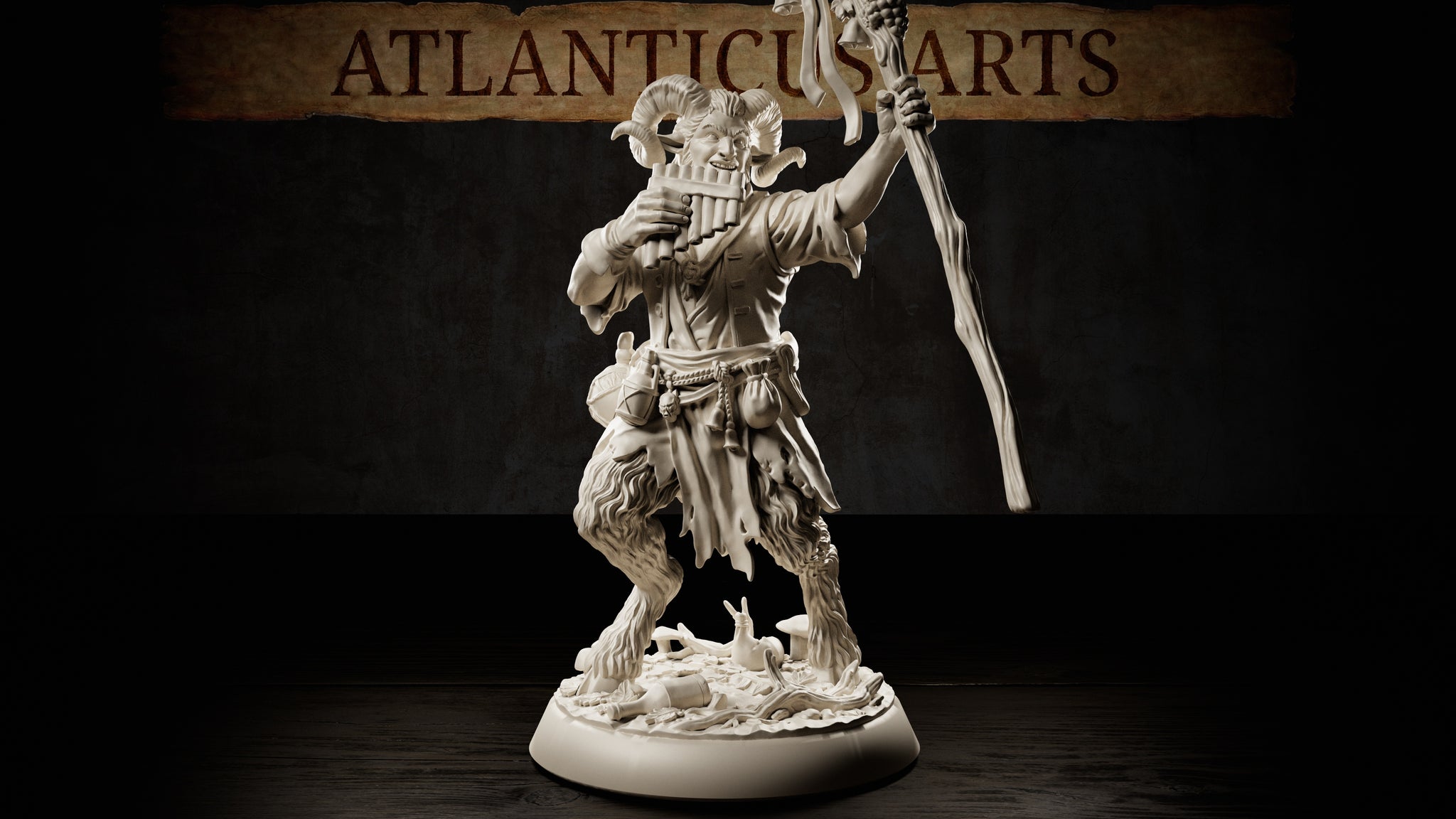 Horned satyr miniature mid-stride, pan pipes raised to grinning lips and a gnarled staff lifted in his other hand, wearing tattered robes and rope belt with pouches, shaggy fur-covered legs ending in hooves, standing on a detailed forest floor base with mushrooms and a snail. Sculpt by Atlanticus Arts.