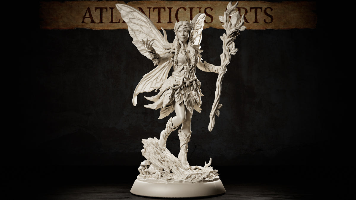 Winged fairy miniature standing on a root-and-mushroom base, holding a leafy staff aloft, wearing a leaf skirt and bodice, long braided hair, large veined wings spread wide. Sculpt by Atlanticus Arts.