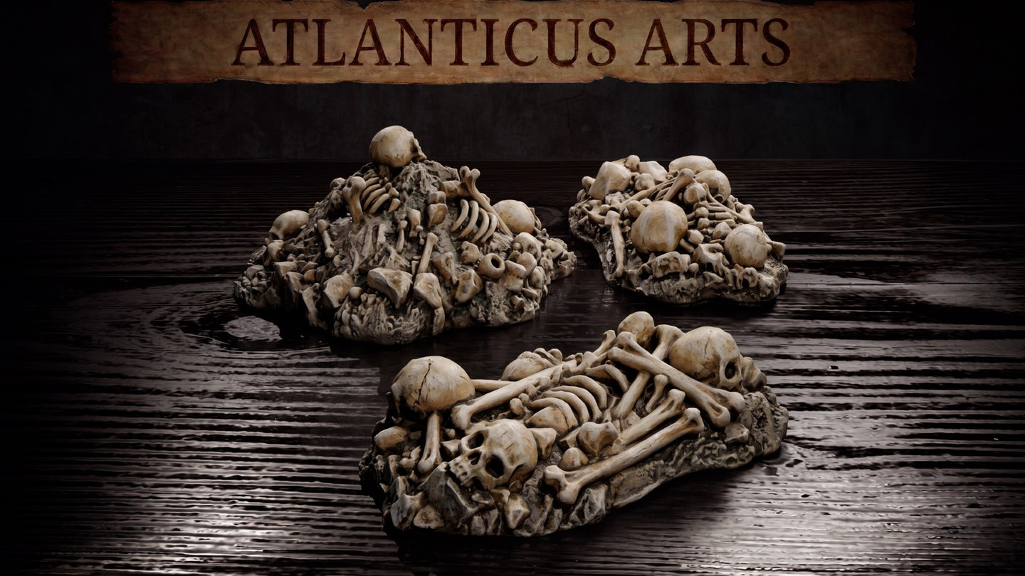 Three bone pile scatter terrain pieces by Atlanticus Arts: two mounded heaps of skulls and bones on rocky bases, one wide elongated piece with articulated skeletal remains including ribs and long bones.