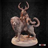 Antlered goblin shaman riding a snarling crag cat, one hand outstretched, wearing layered ritual robes and cord wrappings, mounted on a sandy scenic base. Sculpt by Mia Kay M3DM.