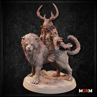 Antlered goblin shaman riding a snarling crag cat, one hand outstretched, wearing layered ritual robes and cord wrappings, mounted on a sandy scenic base. Sculpt by Mia Kay M3DM.