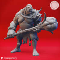 Front view of an unpainted grey resin cyclops miniature — a massive muscular humanoid with a single eye, wide-open roaring mouth, rope bindings on wrists and chest, a spiked stone maul held low at the ready, and trophy skulls hanging from a rope belt. Digital render by Yasashii Kyojin Studios.