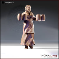 32mm unpainted resin miniature of a broad, cheerful tavern serving woman with braided hair, arms outstretched holding two large tankards in each hand, wearing a laced bodice and layered skirt — Serving Wench 02 by Novaminis