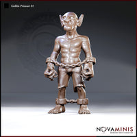 Muscular shackled goblin standing upright, wrists bound by a heavy chain between metal manacles, wearing ragged breeches with ankle shackles. Large pointed ears, heavy brow, blank pale eyes. Sculpt by Novaminis.