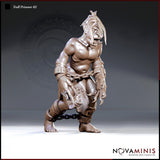 Crouching troll with shackled ankles and wrists bound by chain, bare torso, lank hair, splayed claws, wearing a rough stitched hide loincloth. Sculpt by Novaminis.