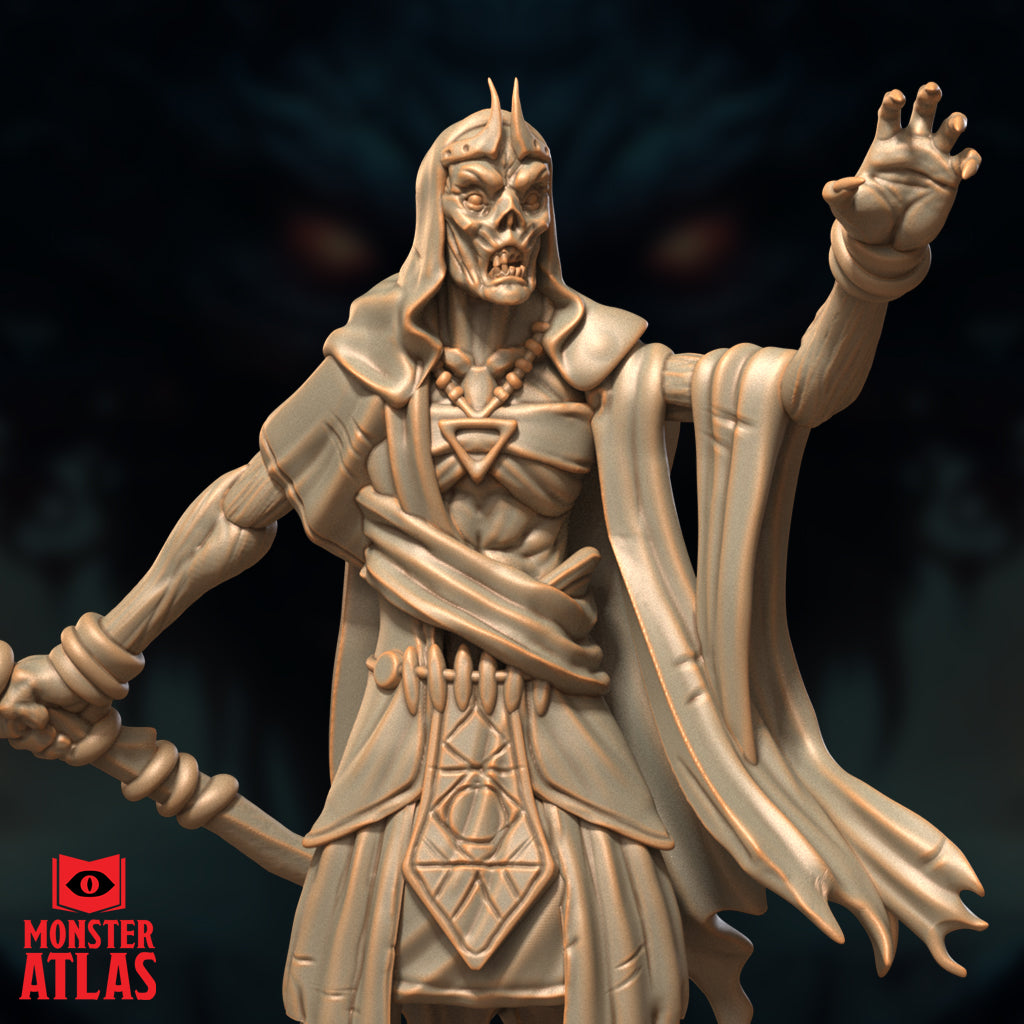 Close-up render of the Deathlock Mastermind miniature showing its skeletal face with horned crown, raised clawed hand, beaded amulet, and arcane-engraved tabard — unpainted gold-toned render by Monster Atlas