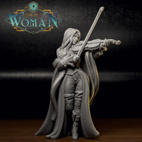 Photograph of a printed Vincentia the Dhampir Bard miniature, front three-quarter view — unpainted grey resin showing fine surface detail on cloak, corset embroidery, and violin, 32mm scale tabletop miniature by DnD is a Woman