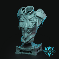Digital render of the Divine Dullahan Bust by Witchsong Miniatures — an unpainted teal resin bust showing ornate angular breastplate with bat-winged crest and filigree detailing, large geometric pauldrons, a wide open collar rising above the absent head, and a textured stone plinth base