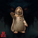 Dohwar Merchant miniature by Monster Atlas — rotund penguin-folk figure in a hooded cloak, right hand raised open with splayed claws, beak parted, gemstone clasp at chest. Sculpt by Monster Atlas.