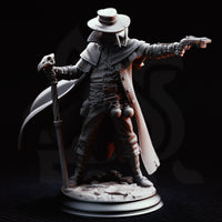 Doktor Jakobson miniature by DM Stash — full figure showing beak mask, multi-buckled leather coat, skull staff, extended pistol arm, and detailed bone-scattered scenic base against dark backdrop.
