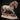Heavily muscled draft horse striding forward, head lowered, mane and feathering rendered in thick flowing ropes, one hoof resting over a ram skull on a cracked earth scenic base. Sculpt by Mia Kay M3DM.