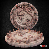 Dragon Summoning Circle by Mia Kay M3DM — two-piece set showing a large circular disc with a coiling dragon in high relief at centre, surrounded by carved glyph border, displayed alongside a round dais base ringed with stone stumps and rocky outcroppings.