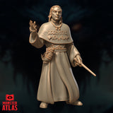 Robed male spellcaster standing upright, right hand raised palm-out at chest height, left hand holding a slender wand. Wide embossed runic cape over long flowing robes with belted pouch. Sculpt by Monster Atlas.