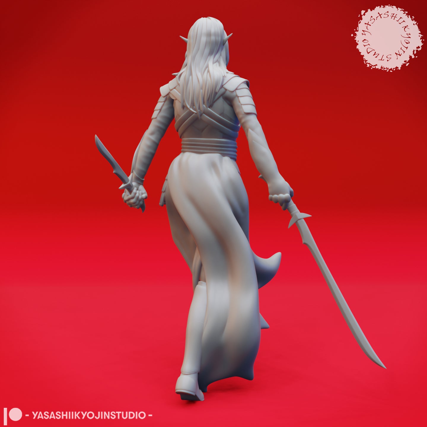 Rear view of an unpainted grey resin drow elf miniature showing long flowing hair, a billowing split coat, shoulder armour, and dual blades held at her sides — sculpted by Yasashii Kyojin Studios