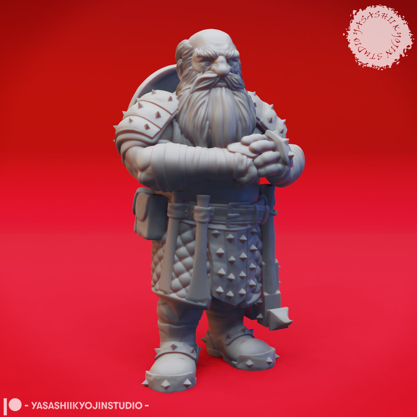 Front view of an unpainted grey resin Duergar miniature — a stocky dwarf warrior with arms folded, spiked pauldrons, quilted gambeson, studded belt, spiked sabatons, and a flail held in the right hand. Sculpted by Yasashii Kyojin Studio.