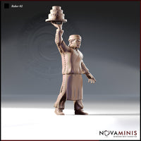 Digital render of Baker 02 miniature by Novaminis — a male human baker in headband and apron, striding confidently with one arm raised high to balance a three-tiered celebration cake on a platter. Unpainted clay-coloured render at 32mm scale.