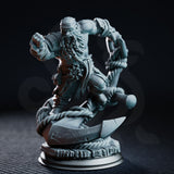 Stocky dwarf sailor miniature perched atop a ship's anchor with thick rope coiled around the base, one fist raised to strike, braided beard flowing. Sculpt by DM Stash.