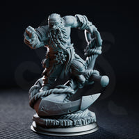Stocky dwarf sailor miniature perched atop a ship's anchor with thick rope coiled around the base, one fist raised to strike, braided beard flowing. Sculpt by DM Stash.