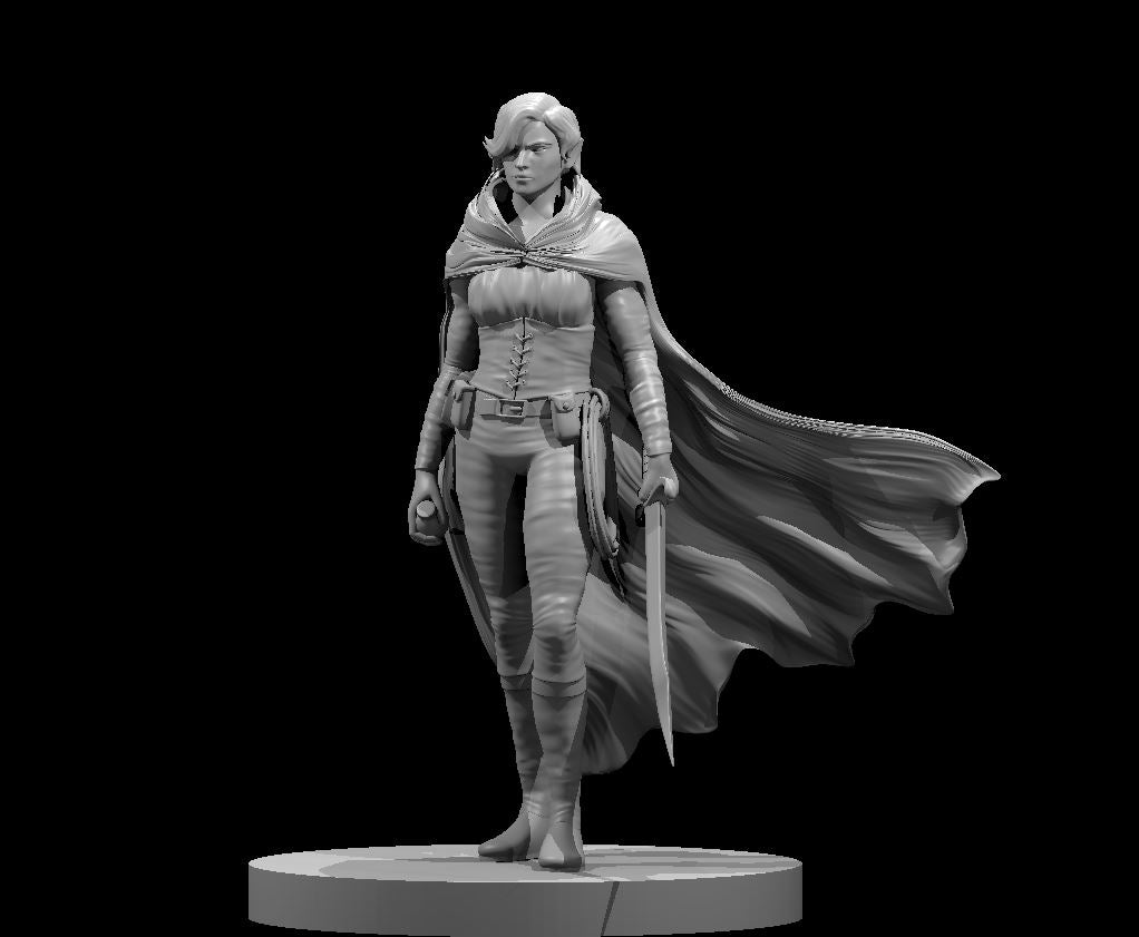 Unpainted grey resin miniature of a female elf rogue at 32mm scale, standing in a confident ready pose with a sword in her right hand and a second blade at her left side. She wears a laced leather corset, wrapped forearms, knee-high boots, and a utility belt. A large flowing cape billows dramatically to her right. Her expression is focused and composed. The miniature is mounted on a round base and shown against a black background.