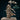 Elf druid Cilarien raising one arm overhead to hold swirling sculpted clouds with a central orb, robes and cloak billowing, long wavy hair, composed upward gaze. Sculpt by DnD Is A Woman.
