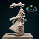 Rear of elf druid Cilarien showing cascading wavy hair, billowing layered robes, swirling cloud element held aloft, and sculpted cloud base at her feet. Sculpt by DnD Is A Woman.