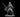 Female elf miniature in a wide combat stance, holding two long swords extended outward, wearing a belted jacket, tall boots, and a flowing cape pinned at the collar. Sculpt by MZ4250.