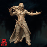 Wide front-facing view of the Eli Tomorast unpainted resin miniature capturing the full silhouette — arms spread wide with both clawed hands extended, longsword at the hip, flowing coat, bare torso with harness strapping, and intense corrupted expression. Monster Atlas logo visible.