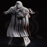 Hooded crossbow knight bust, raised crossbow aimed forward, chainmail coif and armoured helm, fur-trimmed cloak, ornate plinth base with cross motif. Sculpt by DM Stash.