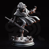 Erina of Amarth striding forward with a longsword lowered at her side and her right hand raised, channelling arcane energy. She wears a layered longcoat, travelling armour, and a circular medallion. Sculpt by DM Stash.