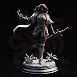 Erina of Amarth mid-stride, longsword carried low in her left hand and right arm extended with a clawed magical focus. Hair swept back, longcoat over buckled armour. Scenic base with grass tufts and crystal shards. Sculpt by DM Stash.