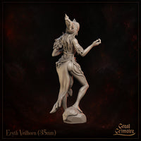 Eryth Veilhorn by Great Grimoire — rear view revealing layered feather and cloth detailing across the shoulders and skirt, rope belt, flowing hair, and the asymmetric silhouette of the horned headdress from behind.