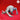 Digital render of Ettercap 04 miniature by Yasashii Kyojin Studio — front-facing view showing the creature low to the ground, four splayed clawed limbs extended, swollen abdomen raised, and a cluster of small eyes above a featureless maw, unpainted grey resin render on red background