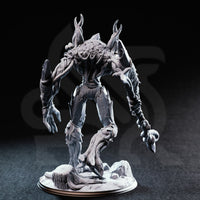 Rear three-quarter view photograph of the unpainted grey resin Evarak Treant of Duskweave miniature, highlighting the gnarled root-like legs, vine wrappings, splintered bark detail across the back and arms, and the barbed weapon tip visible swinging at the end of the outstretched arm.
