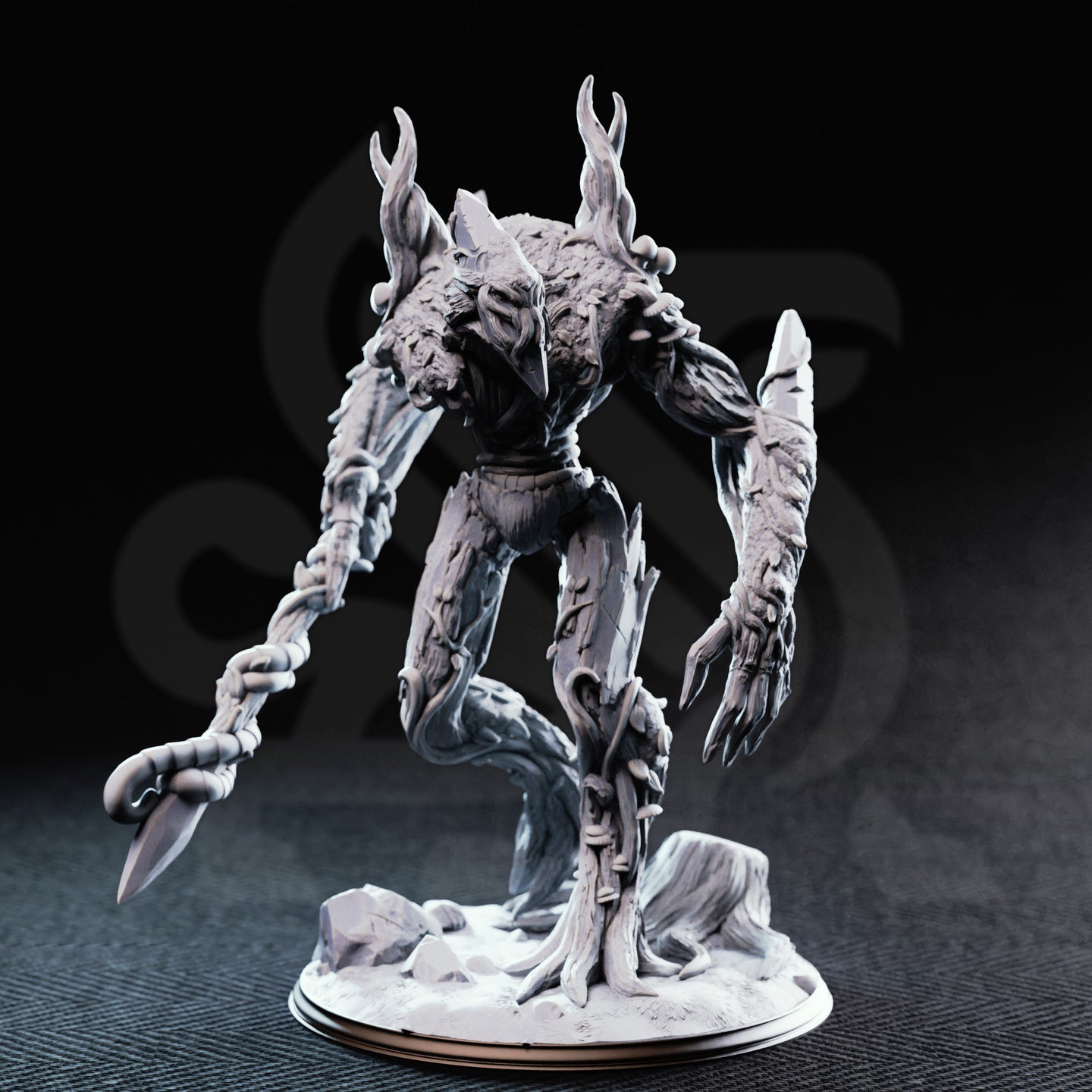 Front view photograph of the unpainted grey resin Evarak Treant of Duskweave miniature, showing the hollow mask-like face, mushroom growths on the torso, deeply textured bark surface detail, and barbed branch-flail weapon. Mini is posed dynamically with one leg raised.