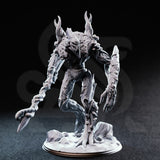 Front view photograph of the unpainted grey resin Evarak Treant of Duskweave miniature, showing the hollow mask-like face, mushroom growths on the torso, deeply textured bark surface detail, and barbed branch-flail weapon. Mini is posed dynamically with one leg raised.