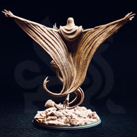 Unpainted resin miniature of Exelian the Forbidden viewed from the rear — showing the sweeping membrane wing detail with deep ribbed striations, serpentine coiled lower body with a barbed tail, talon foot, and the full extent of the scenic rubble base