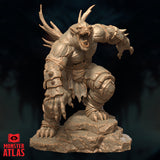 Farastu Demodand 32mm resin miniature by Monster Atlas — front-right view showing the creature lunging forward, jaw wide open with rows of serrated teeth, crown of gnarled antler horns, spiked gauntlet on the outstretched right arm, and crude armoured bracers bound with cord, mounted on a rocky rubble base. Unpainted sandy-beige render.