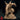 Farastu Demodand 32mm resin miniature by Monster Atlas — front-right view showing the creature lunging forward, jaw wide open with rows of serrated teeth, crown of gnarled antler horns, spiked gauntlet on the outstretched right arm, and crude armoured bracers bound with cord, mounted on a rocky rubble base. Unpainted sandy-beige render.