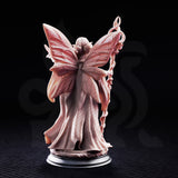 Feena Fairy Godmother by DM Stash — winged fey figure in layered robes holding a gnarled twisted staff aloft, a small bird perched on her outstretched hand, four large butterfly wings spread wide behind her.